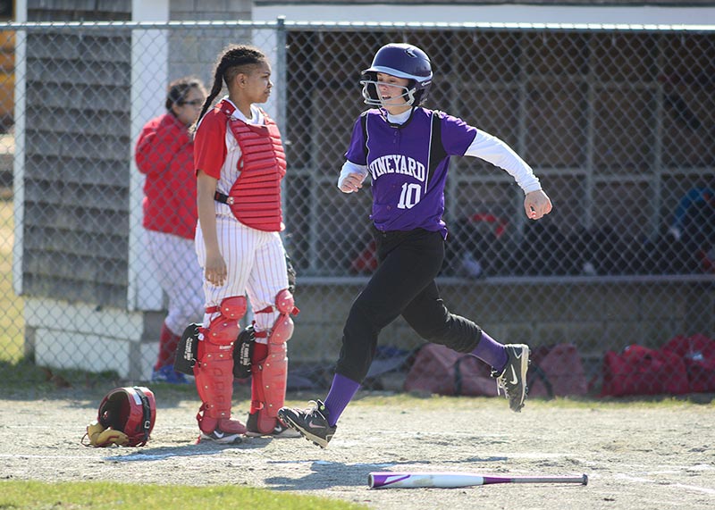 Julia Bettencourt crosses home plate in the second inning.