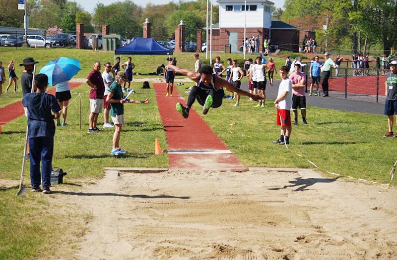 Ennis Foster in the long jump.