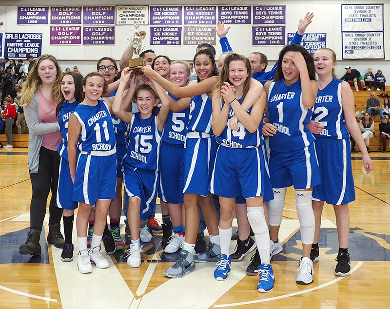 The Charter School girls celebrate their championship win.