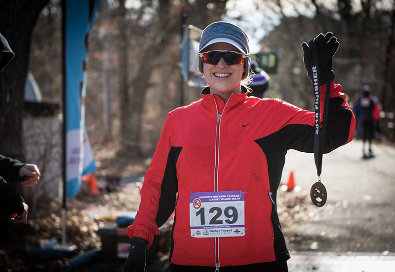 Emily Locher crosses the finish line.
