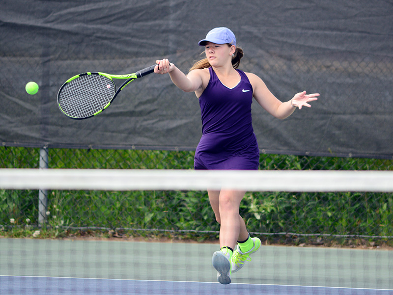 Chesca Quinlan-Potter hits a forehand return.
