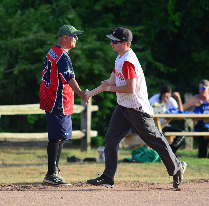 Bobby Branca congratulates Noah Stobie on his home run in the second inning.