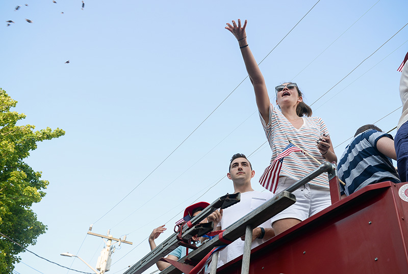 Candy is tossed by one of the cars in the parade.