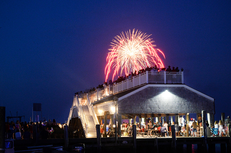 A crowd watches fireworks near the Chappaquiddick ferry.