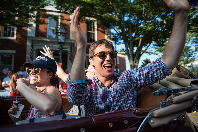Rep. Dylan Ferdandes throws candy to the Main Street crowd.
