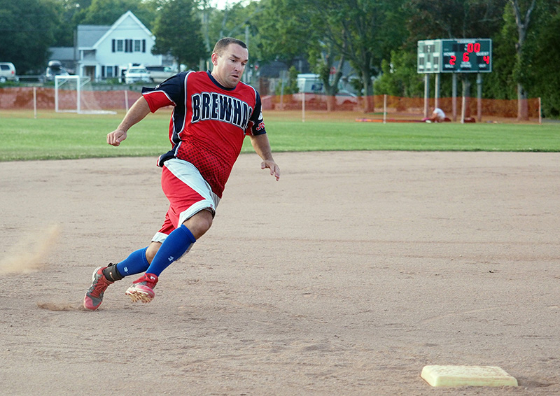 Matt Gebo hustles around third to score in the Brewhas sixth.