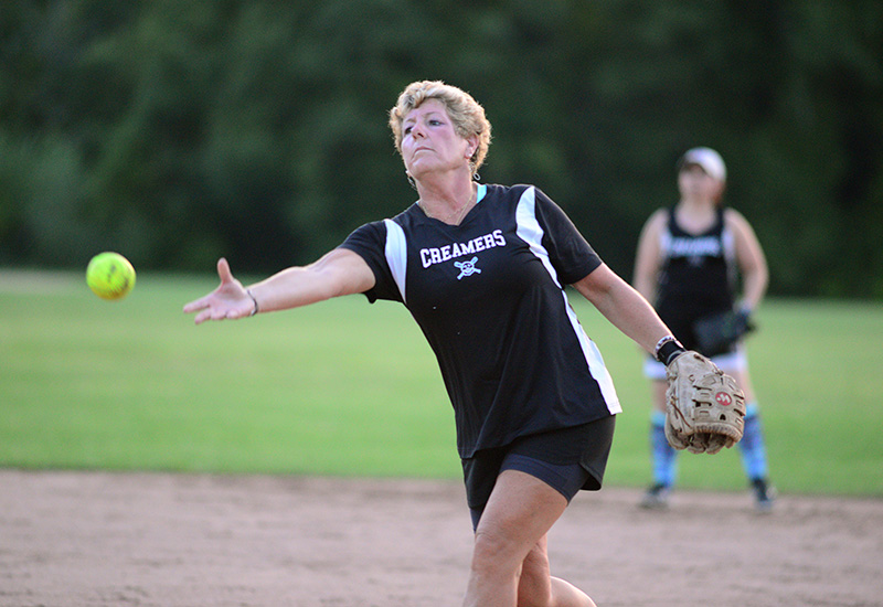 Alleyne Hughes throws to the plate in the seventh inning.
