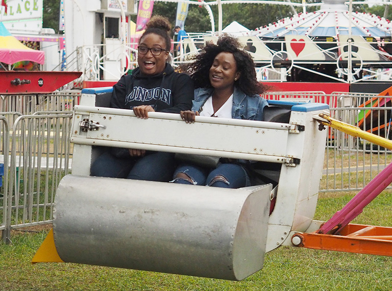 Sydnee Bullard and Shawna Brown ride the Sizzler.