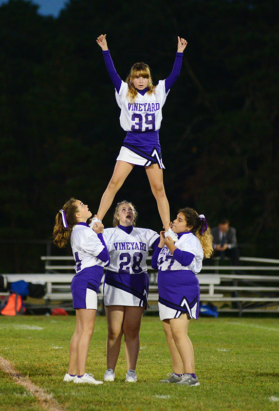 The Vineyard junior high cheerleaders perform at halftime.