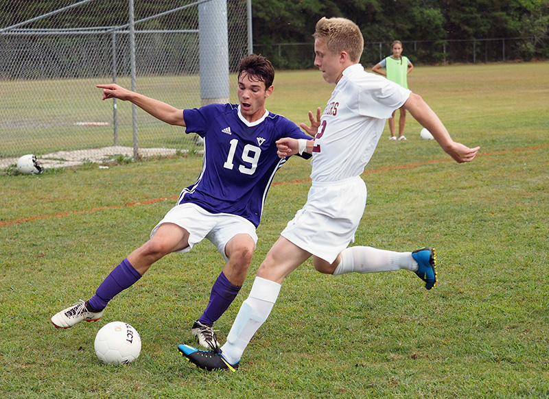 MV’s Tim Wallis and Cape Tech’s Xavier Freeman vie for possession.