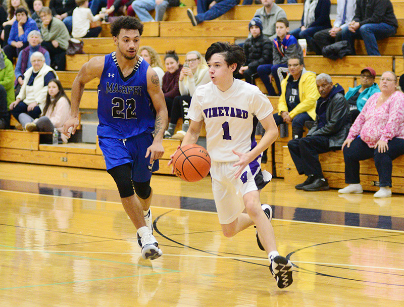 Jeremy Regan drives to the hoop, guarded by Devaun Ford.