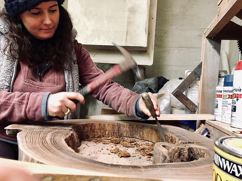 Liz Ragone works on a piece in the workshop.