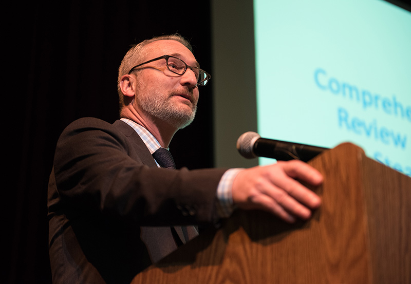 John Sainsbury, president of HMS Consulting, leads the report presentation.