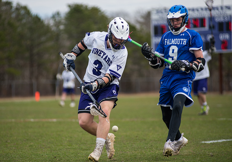 Captain Michael Wallace, No. 3, goes for the ball.