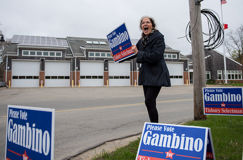 Lorraine Parish campaigns for Seth Gambino outside the polling place.
