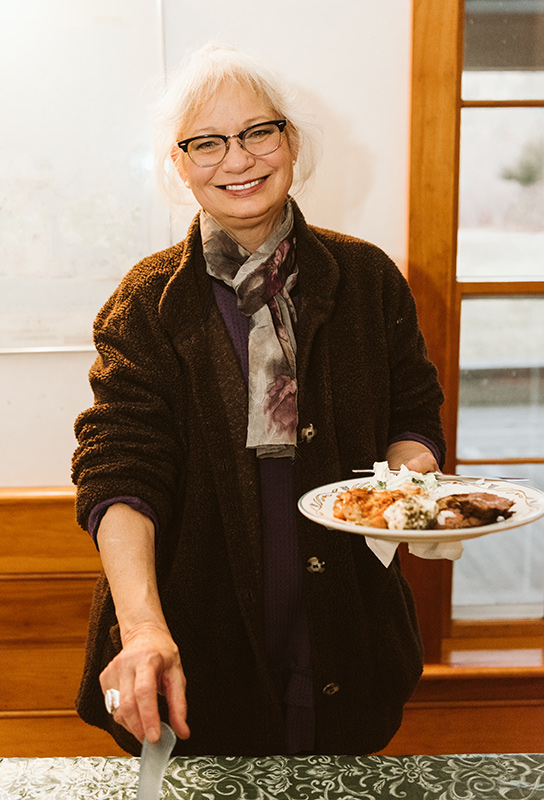 Laura Barauskas is ready for mindful eating of her delicious potluck plate.