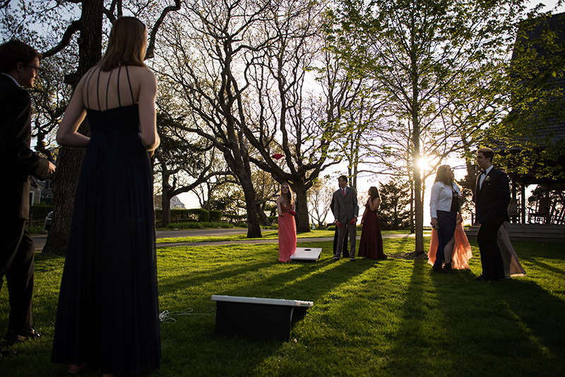 Ashley Biggs, left, and her date Owen Atkins play corn hole.