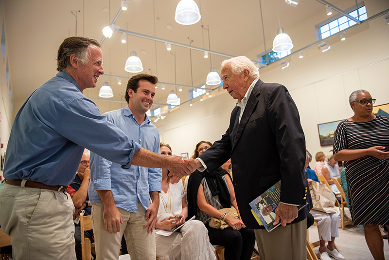 David McCullough, right, greets his friends and family in the audience.