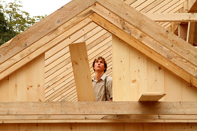 David_Glick_hangs_wall_boards