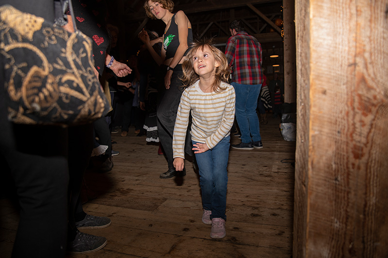 Summer Price, 5, enjoys music by Johnny Hoy and the Bluefish.