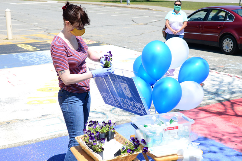 Jillian Greeley picks out her graduation flowers provided by 4Cs.