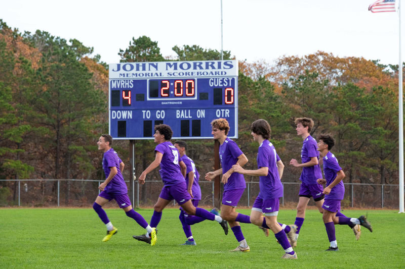 Boys-Varsity-Soccer_team-running-scoreboard.jpg