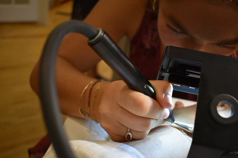 1_25_Jewelry_Bracelet being welded onto customers wrist.jpg