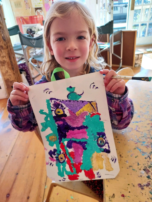 Lucy sharing her work. Photo cred.