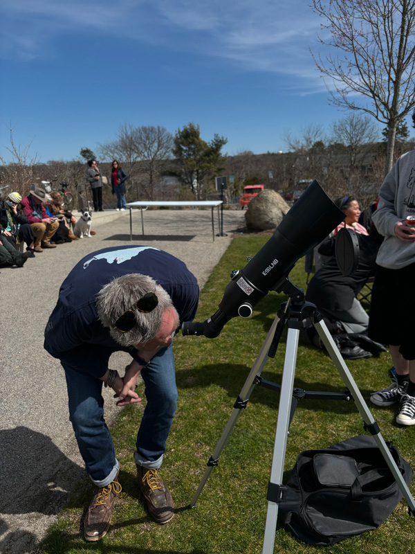 Craig uses a telescope he bought just for the eclipse.