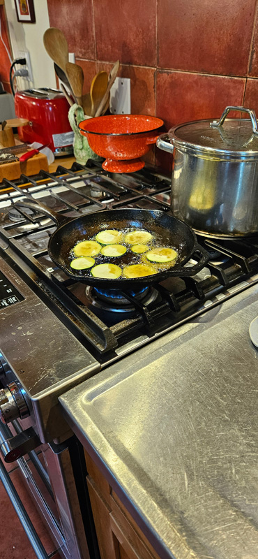 Zucchini cooking in Olive Oil