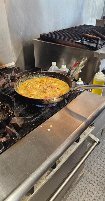Shrimp mixed in with herbs, spices, and veggies