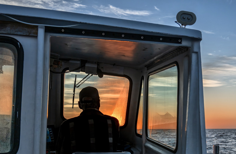 Capt. Ed welcomes the new day aboard “Tenacious”