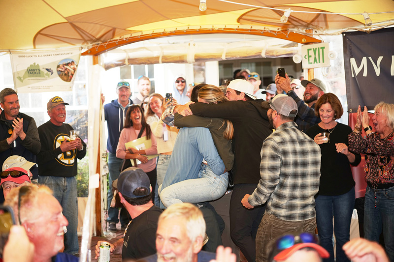 Sam Bell hugs wife and friends.