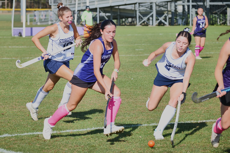 Lara Sedlier (No. 6) moves through Sturgis pressure with ball control.