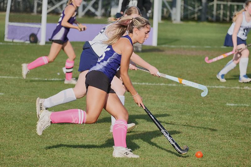 Lethicia Diniz (No. 26) moves with Sturgis pressure on.