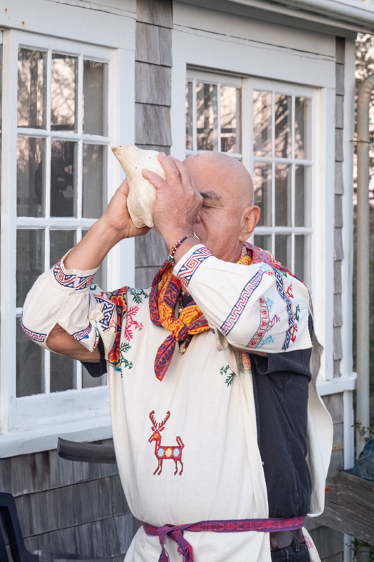 Jose Sanabria made beautiful sounds blowing into a conch shell.
