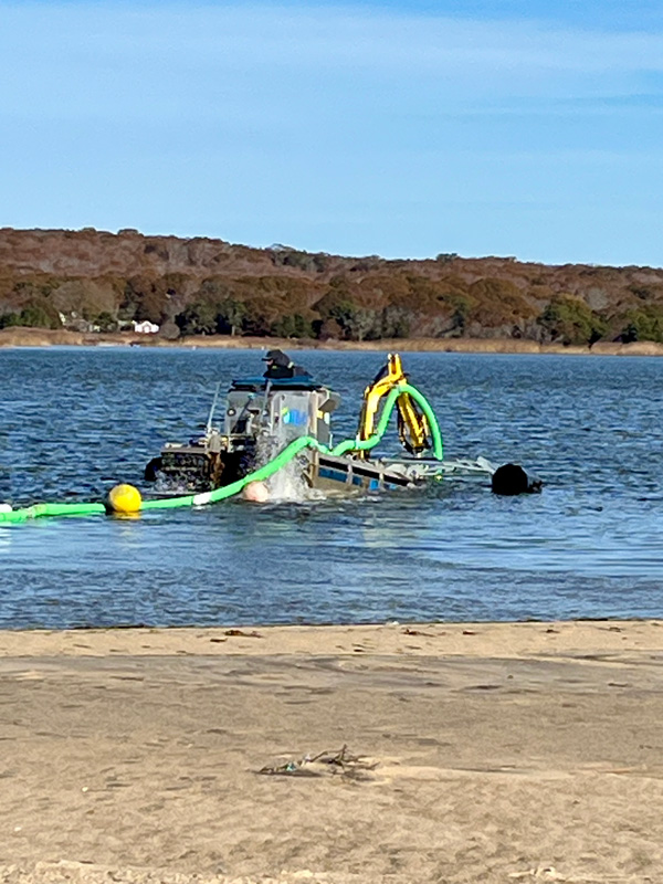 Truxor dredging Chilmark Pond.
