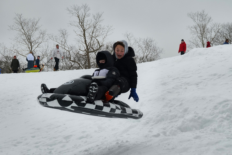 Islanders go airborn on the sled.