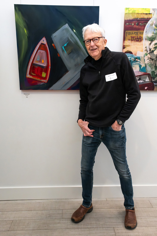 Marston Clough and his “Red Boat” oil painting.