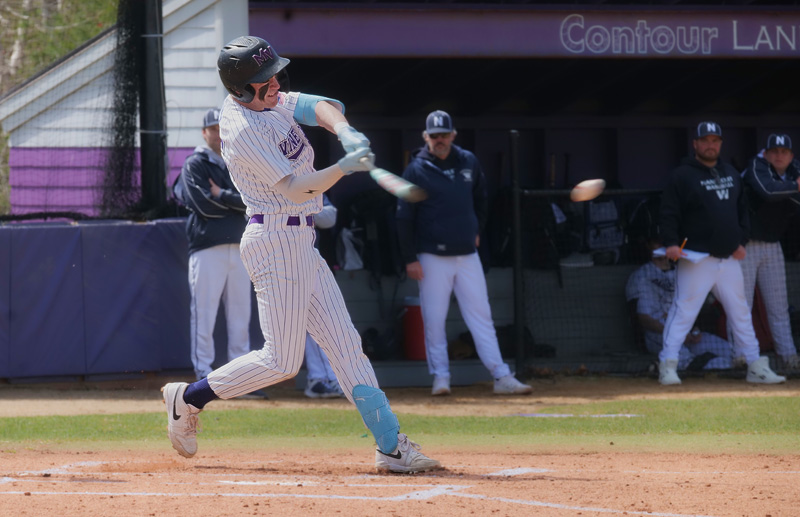 Joe Medeiros (No. 15) connects with a Nantucket pitch.
