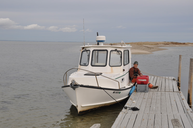 Liam Cosgrove with his boat the Oyster Catcher.